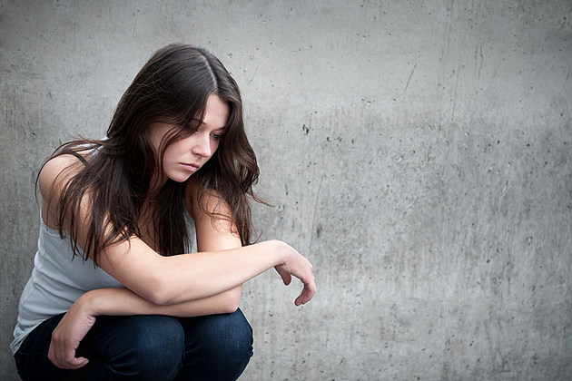Teenage girl looking thoughtful about troubles